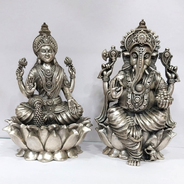 Blissful Pure silver lakshmi ganesh idols On Lotus...