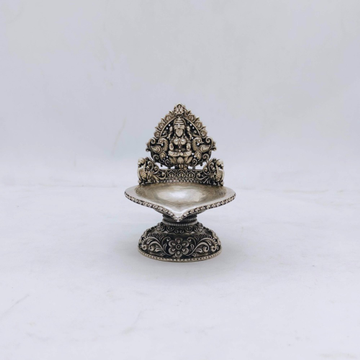 Hallmarked silver kamakshi lamp with peacocks in a...